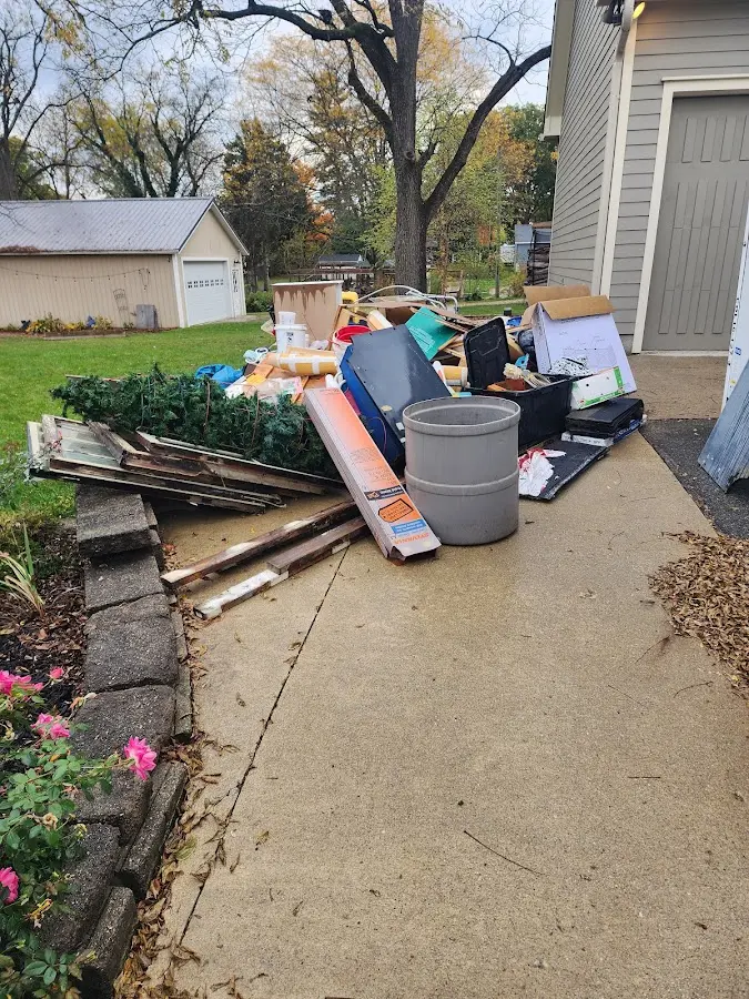 Dumpster being loaded with debris for 30 Yard Dumpster Rental in Wisconsin Rapids